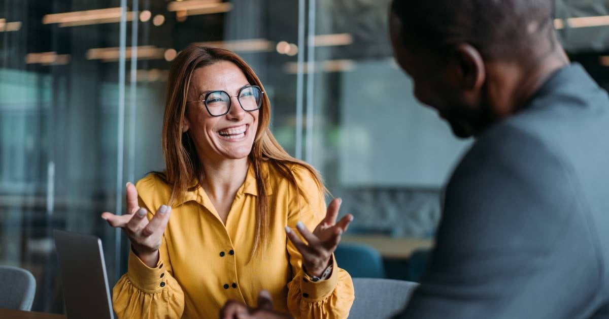 A software engineer meets with a business leader