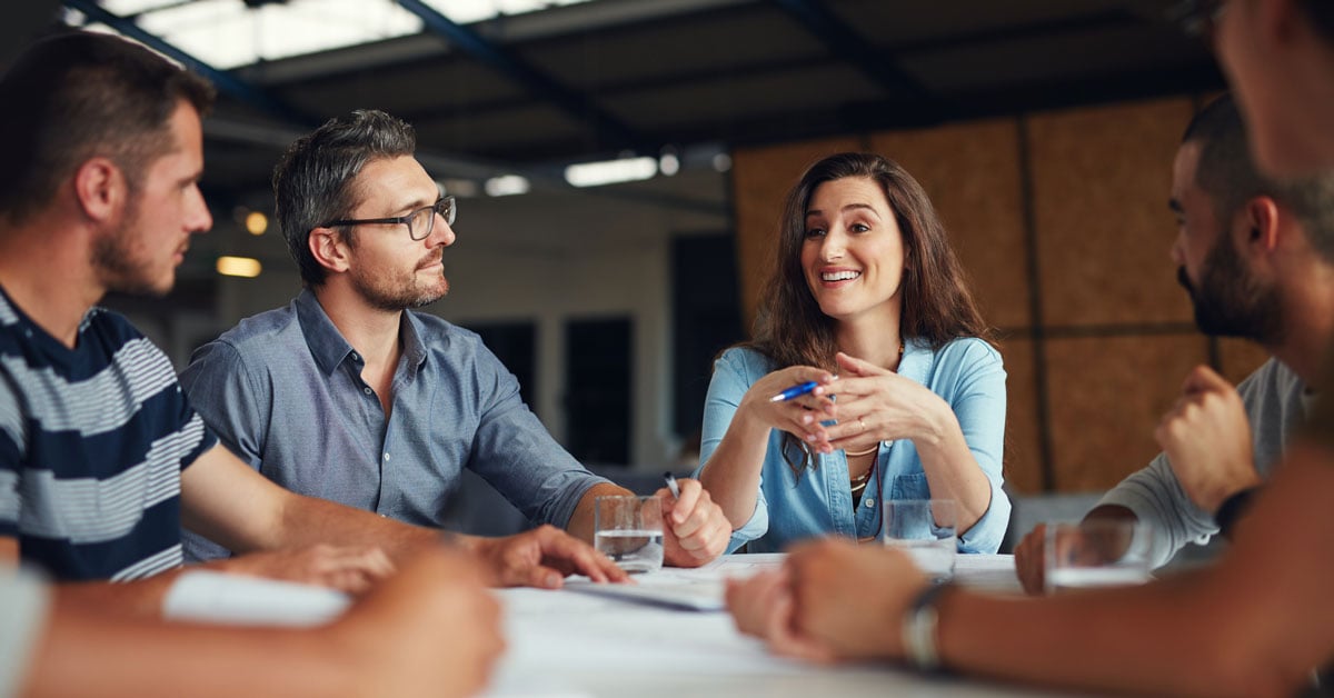 A group of hospitality leaders collaborating at an engaging meeting. 