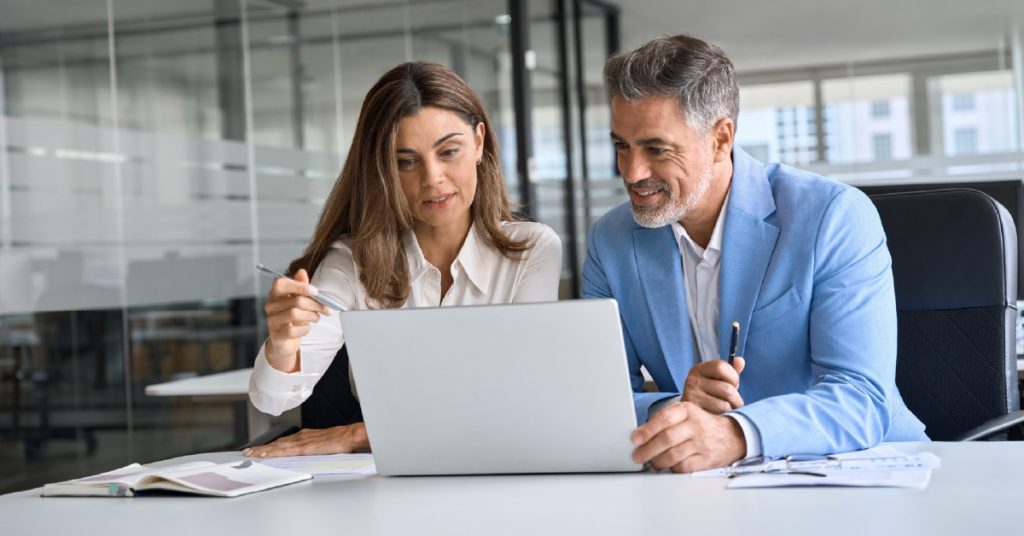 Executives discussing an upcoming custom software development project