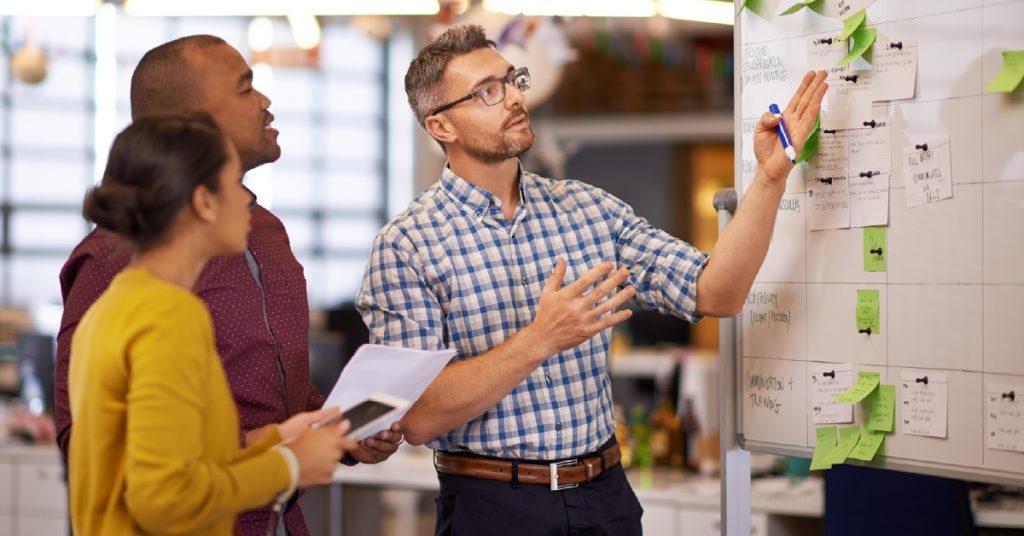 Custom software team strategizing together