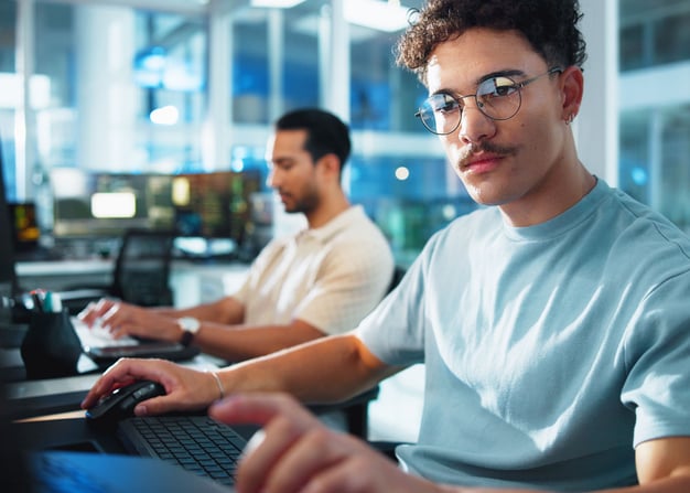 male-software-engineer-focusing-on-computer