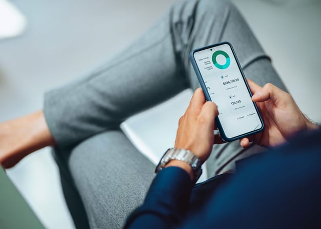 An employee uses an app on their mobile phone.