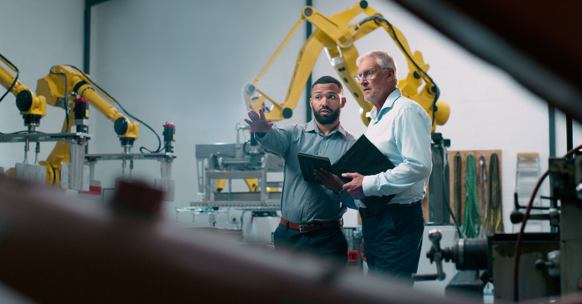 A manufacturer consults with a custom software specialist.