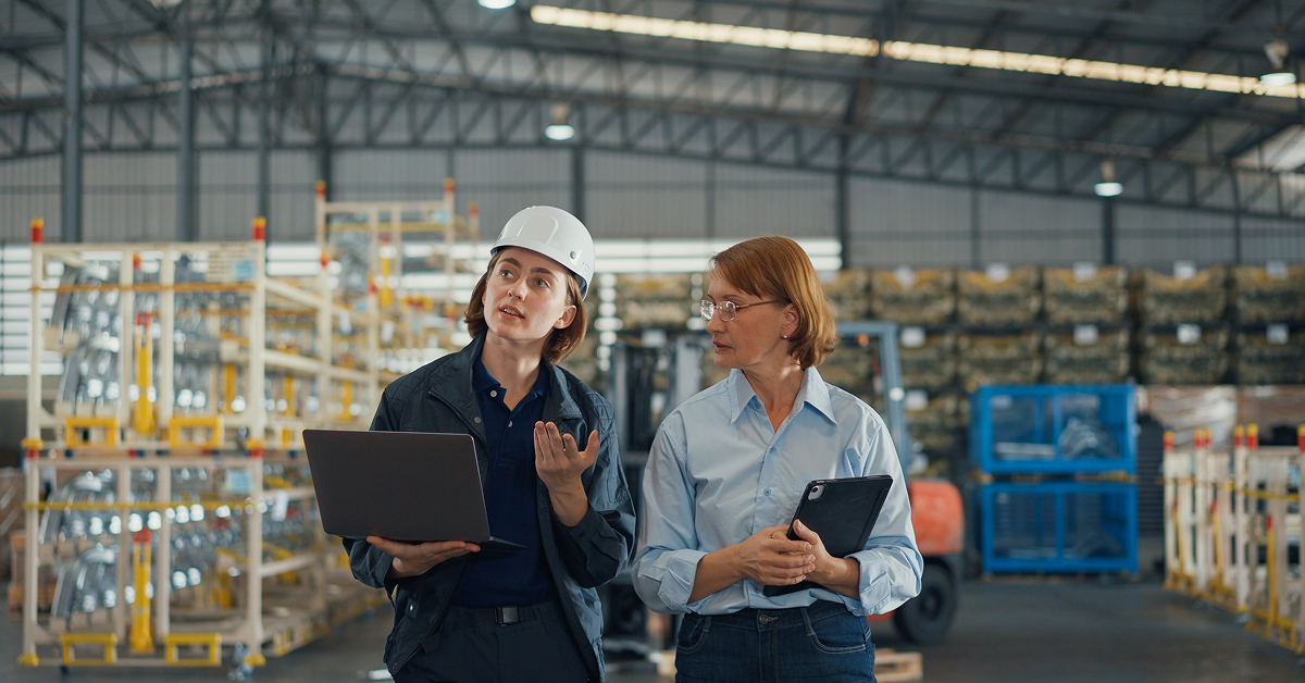 A software engineer meets with a manufacturing client to explore business process automation.