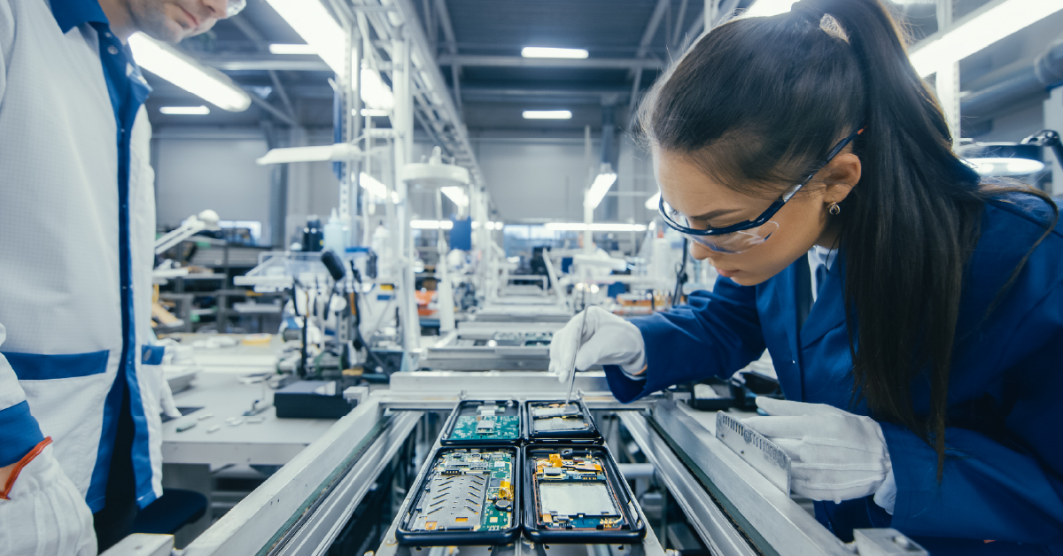 A manufacturing worker helping to build advanced electronics at a smart factory.